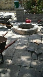 Landscape Contractors working on a fire pit Custom Hardscape in Schererville