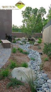 Landscaping Services in Crown Point add curb appeal with rock bed and plants